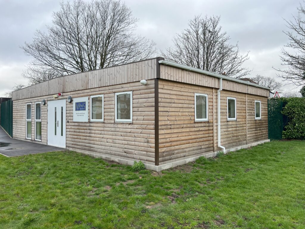 modular building with wooden cladding