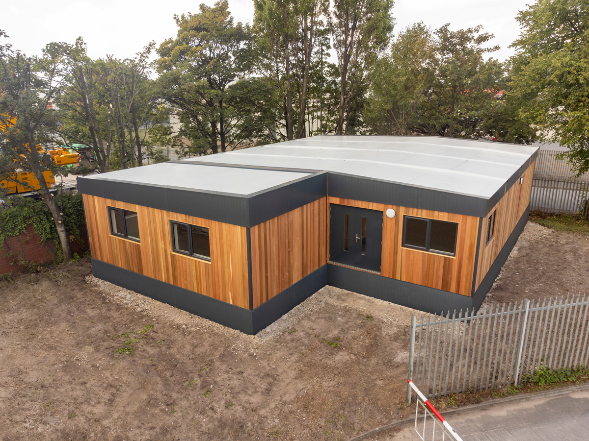 Modular building with wood cladding aerial view