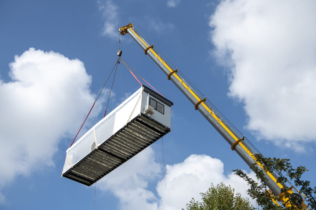 Installing a modular building with a crane