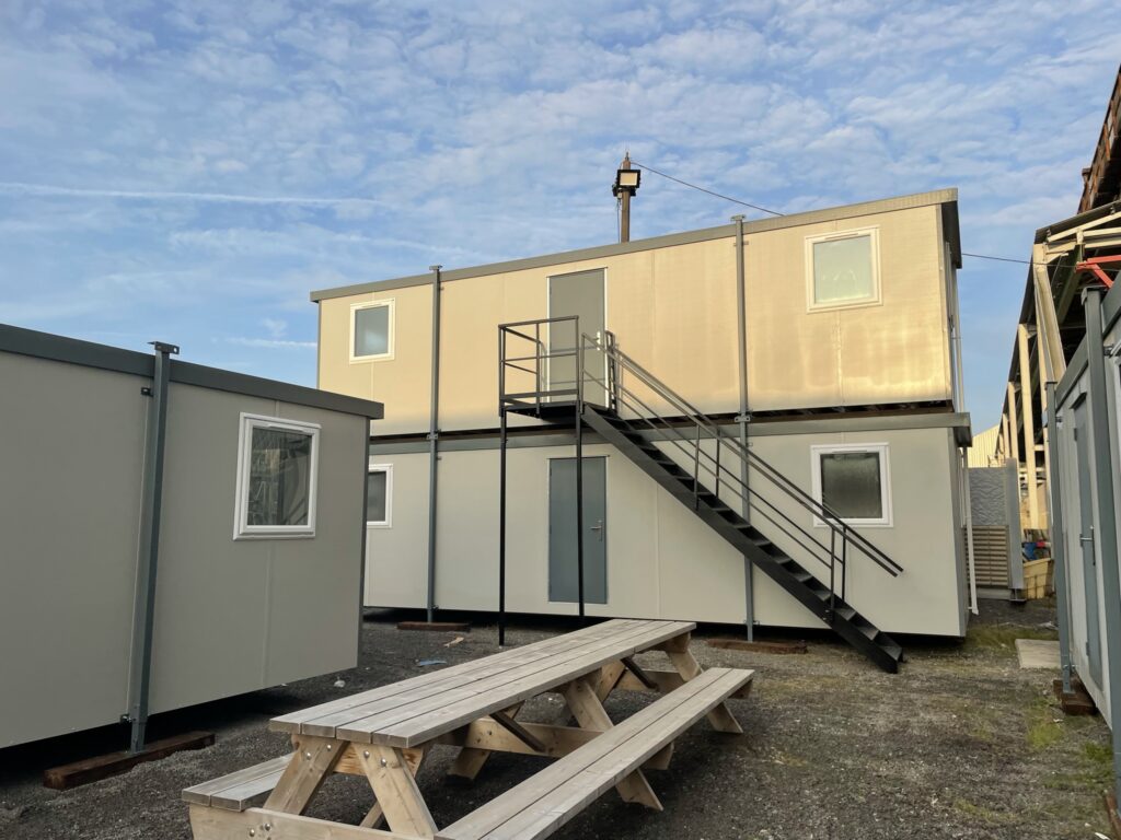 Stacked portable cabins with a blue sky background